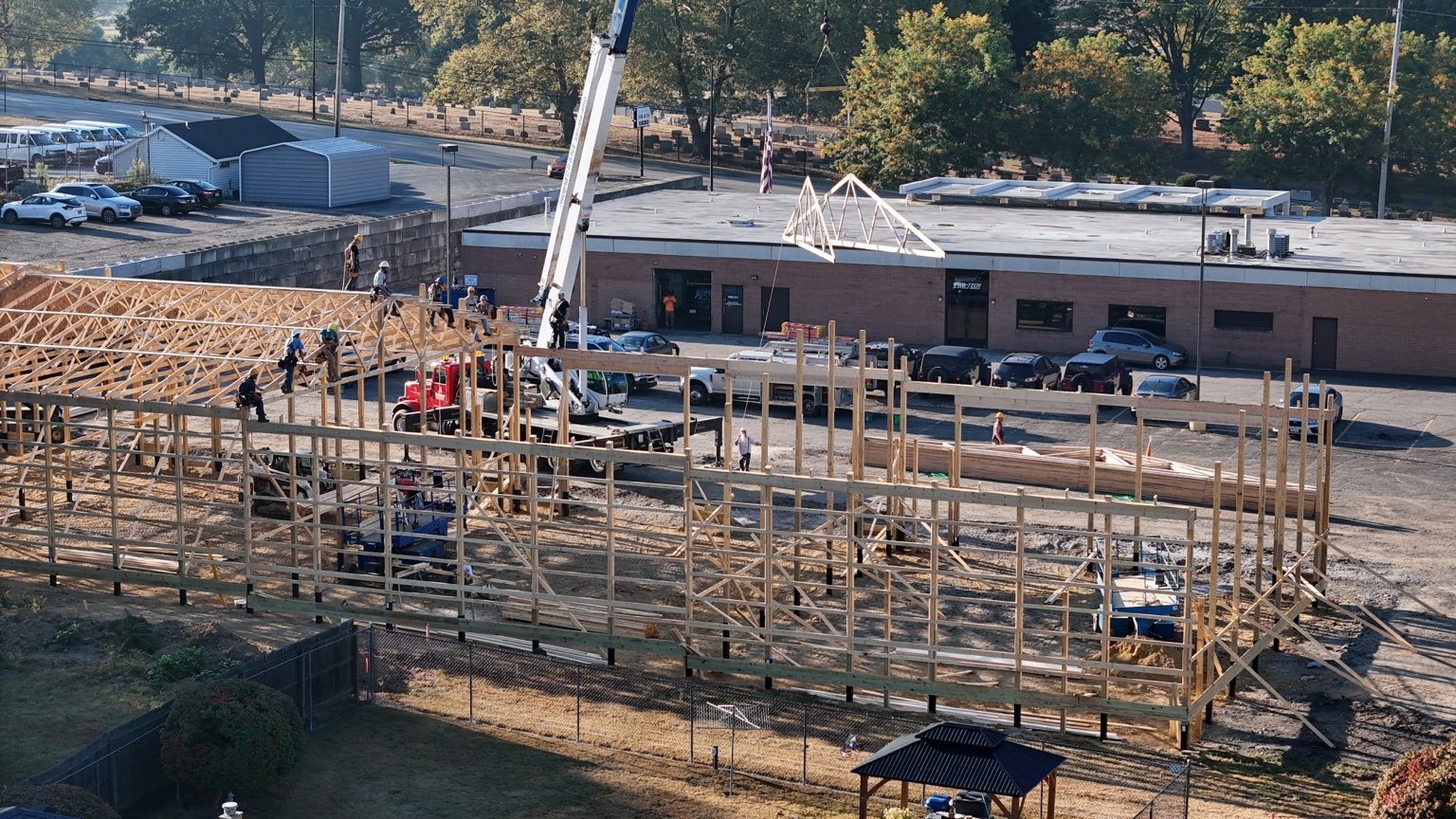 Crane setting roof trusses on PROFLEX commercial garage building in Akron Ohio